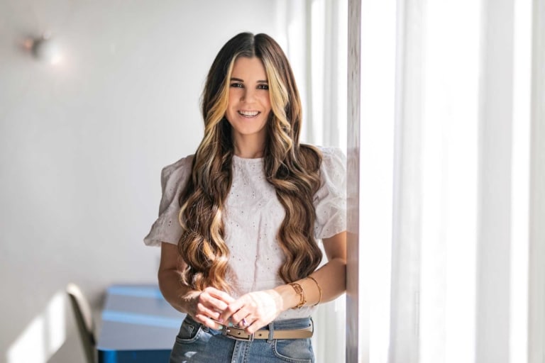 Influencer Manou beams with her Hairdreams hair extension.