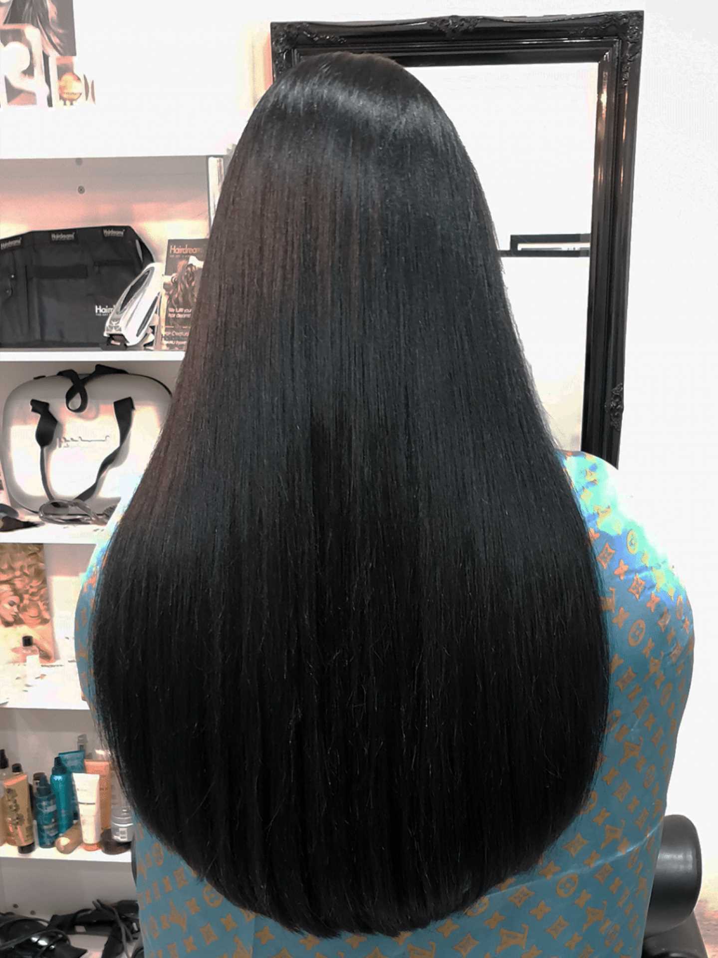 After picture of hair thickening in lengths and tips on a woman with black hair