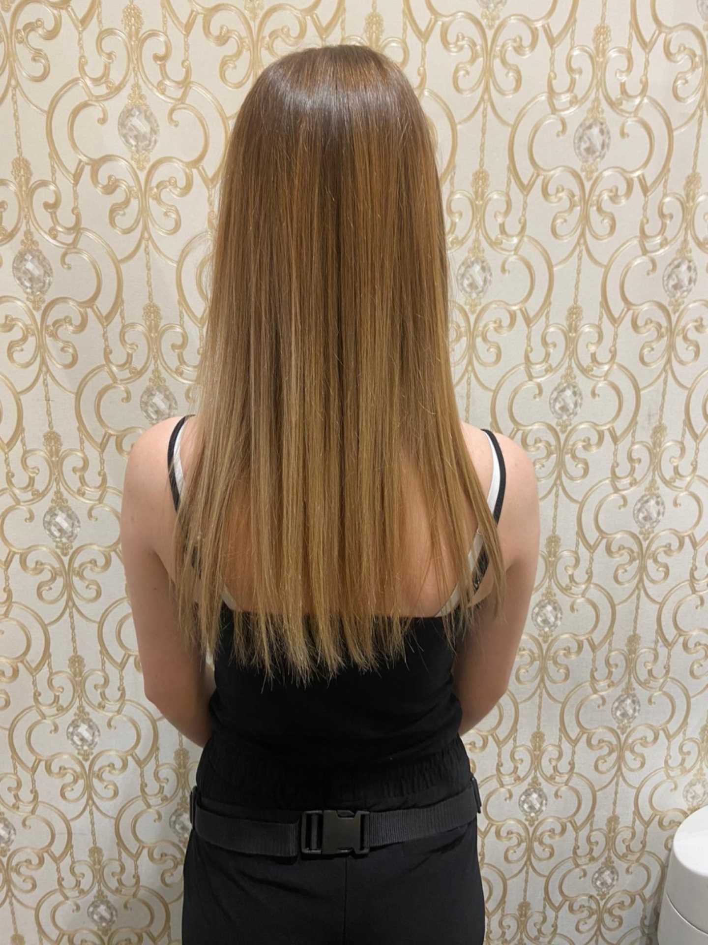 Before hair thickening in lengths and tips for a woman with light hair