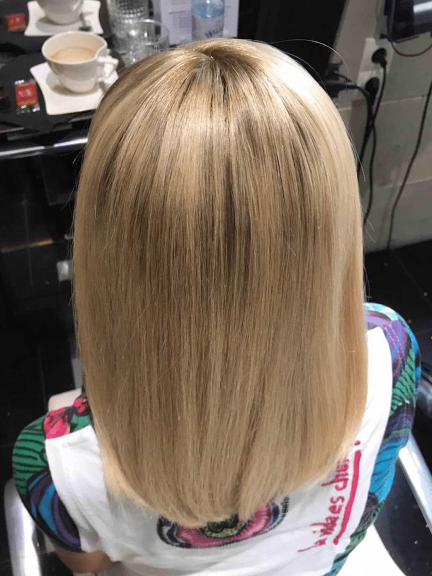 After hair thickening on woman with blond hair