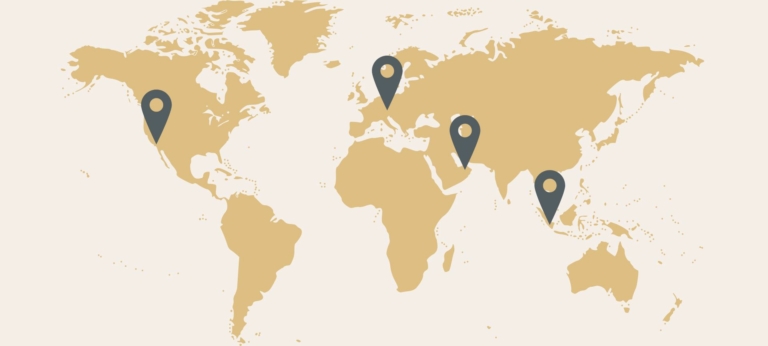 Weltkarte mit vier Stecknadeln, die die Standorte der vier Hairdreams-Headquarters markieren.