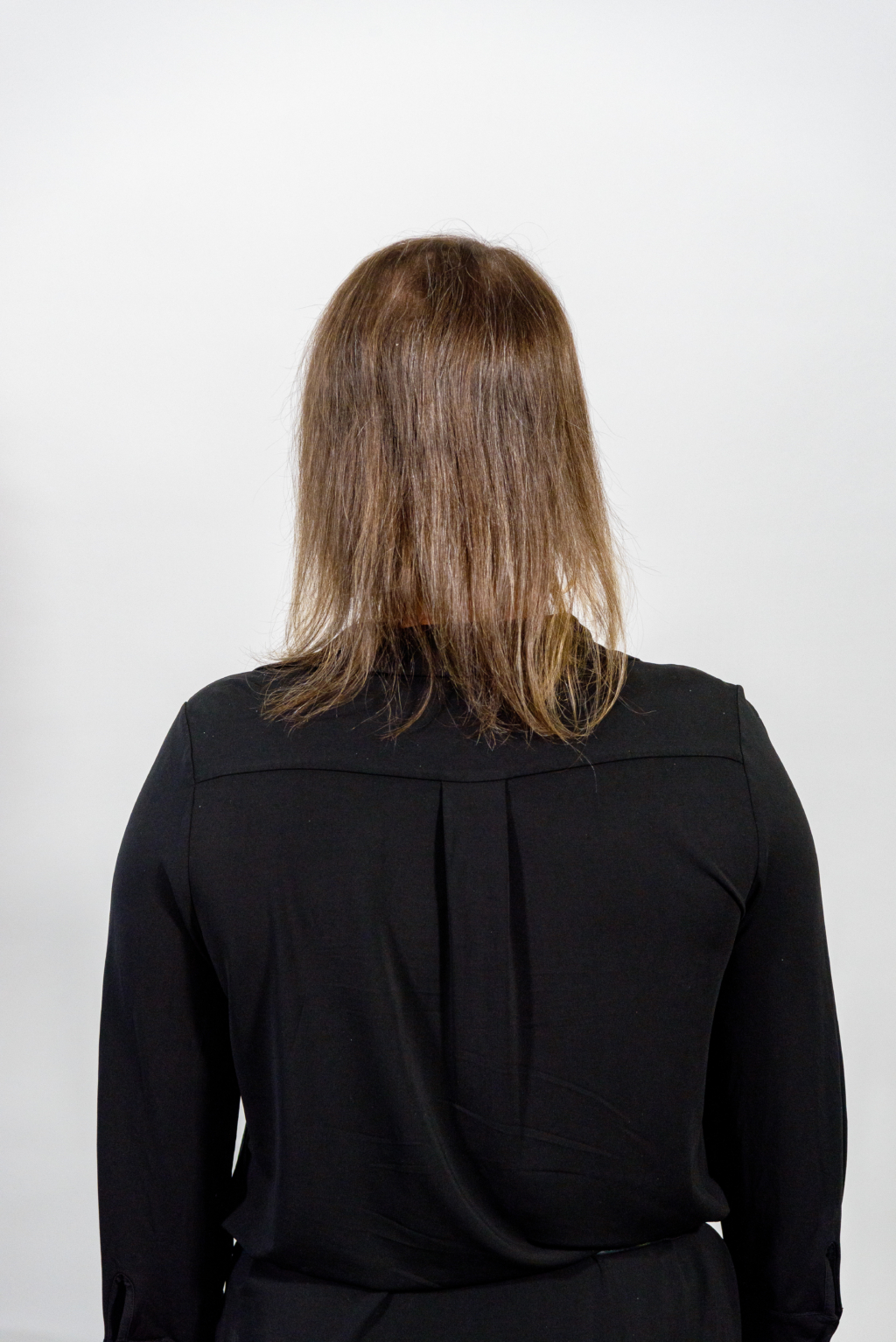 Woman from behind with short thin hair