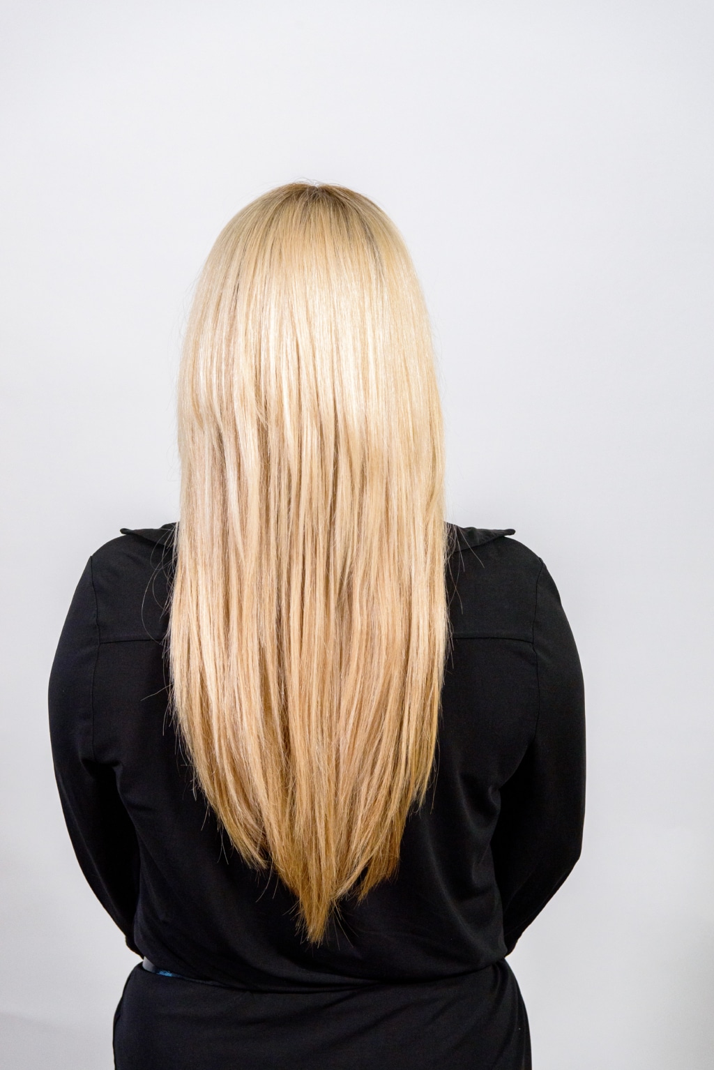 Model with long blonde hair from behind