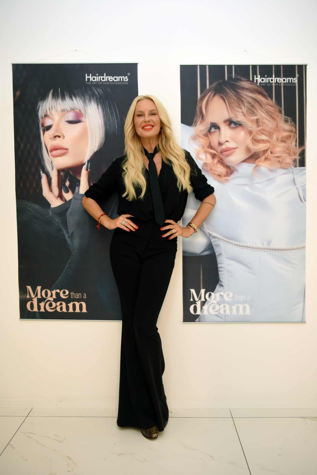 Woman posing in front of a screen